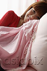 AsiaPix - Asian girl resting on pink sofa