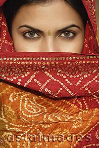Asia Images Group - woman in sari, covering face