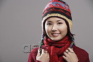 AsiaPix - Head shot of Chinese woman wearing knitted hat