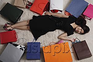 AsiaPix - Chinese woman laying on floor with shopping bags
