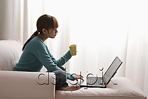 AsiaPix - Asian girl at home on laptop