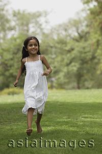 Asia Images Group - Little girl running in park