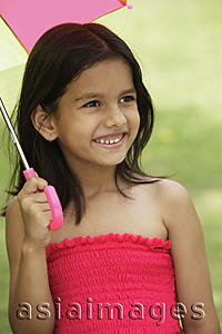Asia Images Group - little girl in pink dress, with umbrella