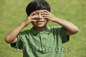 Asia Images Group - Little boy hiding his eyes