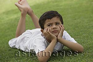 Asia Images Group - Little boy relaxing in park