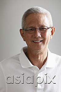 AsiaPix - Head shot of gray haired mature man smiling
