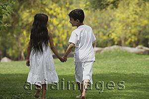 Asia Images Group - two children holding hands walking