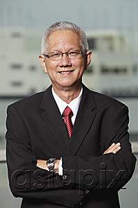 AsiaPix - mature man with grey hair wearing a suit and smiling