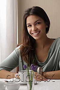 AsiaPix - young woman at a cafe, smiling looking at camera