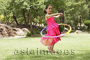 Asia Images Group - little girl playing with hula hoop