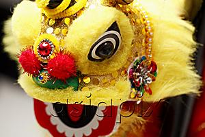 AsiaPix - Yellow lion dance toy. Chinese New Year decoration