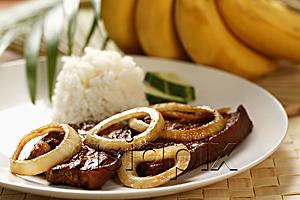 AsiaPix - Pork steak with rice (Bistik Tagalog). Traditional Filipino dish