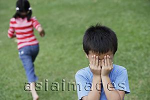 Asia Images Group - kids playing hide-and-seek