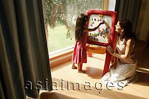 Asia Images Group - mother and daughter at easel