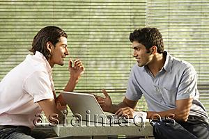 Asia Images Group - two men at laptop in cafe