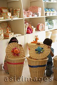 Asia Images Group - kids in shop looking in baskets