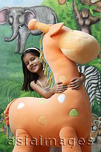 Asia Images Group - little girl with big stuffed giraffe
