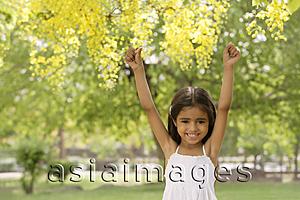Asia Images Group - little girl standing under tree