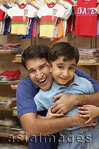 Asia Images Group - father and son in shop