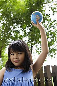 Asia Images Group - Girl holding up globe