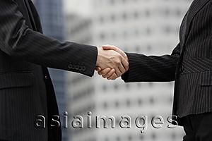 Asia Images Group - Colleagues shaking hands