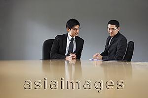Asia Images Group - Two colleagues meeting in a conference room