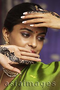 Asia Images Group - woman with hands decorated in henna