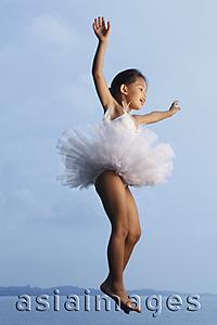 Asia Images Group - Girl jumping in air wearing tutu.
