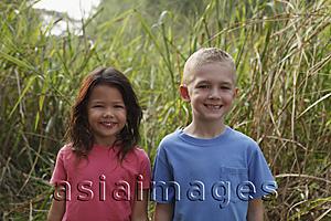 Asia Images Group - Girl and boy smiling at camera.
