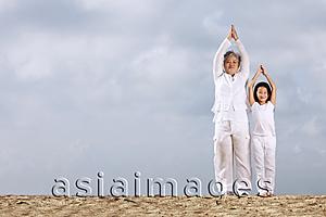 Asia Images Group - Older woman and young girl exercising.