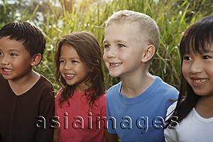 Asia Images Group - Close-up of four children smiling.