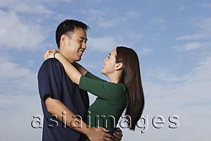 Asia Images Group - Young couple hugging outside