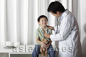 Asia Images Group - Doctor giving a little boy a check up