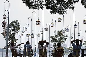 Asia Images Group - Men listening to birds at Bird Park, Singapore