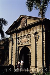Asia Images Group - Philippines,Manila,Couple Walking Through Puerta del Parian, one of the Entrances to the Intramuros Historical District