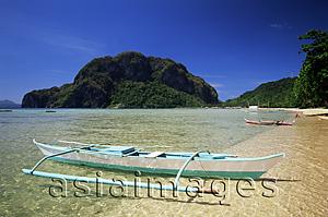 Asia Images Group - Philippines,Palawan,Bascuit Bay,El Nido,Outrigger on Tropical Beach at Sunset