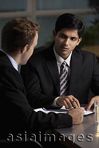 Asia Images Group - Caucasian man talking to Indian man about a document