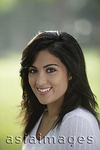 Asia Images Group - Head shot of young Indian woman smiling