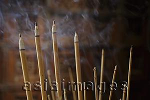 Asia Images Group - Incense sticks burning.