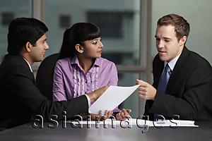 Asia Images Group - mixed raced group talking business