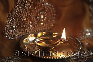 Asia Images Group - Close up of bronze oil lamp
