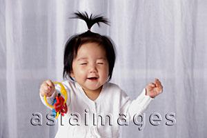 Asia Images Group - Chinese baby smiling with eyes closed