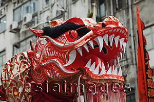 Asia Images Group - Head of dragon during traditional Dragon Dance. Tai Kok Tsui Temple Fair. Hong Kong, China