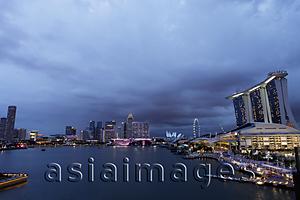 Asia Images Group - View of the buildings surrounding Marina Bay in the evening, Singapore