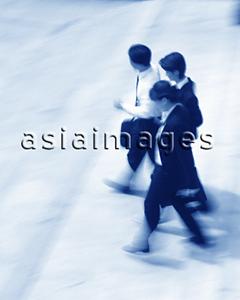 Asia Images Group - Three executives walking (motion blur), (blue tone)