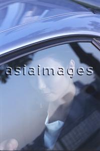 Asia Images Group - Female executive in car