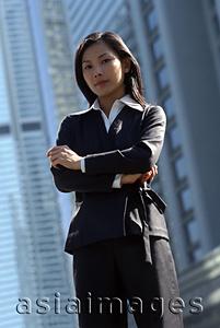 Asia Images Group - Female executive standing, portrait