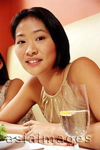 Asia Images Group - Woman at restaurant, portrait