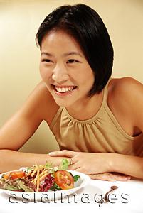 Asia Images Group - Woman at restaurant, smiling