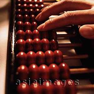 Asia Images Group - Fingers on an abacus